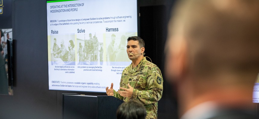 Lt. Col. Vito Errico, then an Army major, speaks at the AUSA conference on Oct. 11, 2021